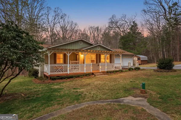 a backyard of a house with lots of green space