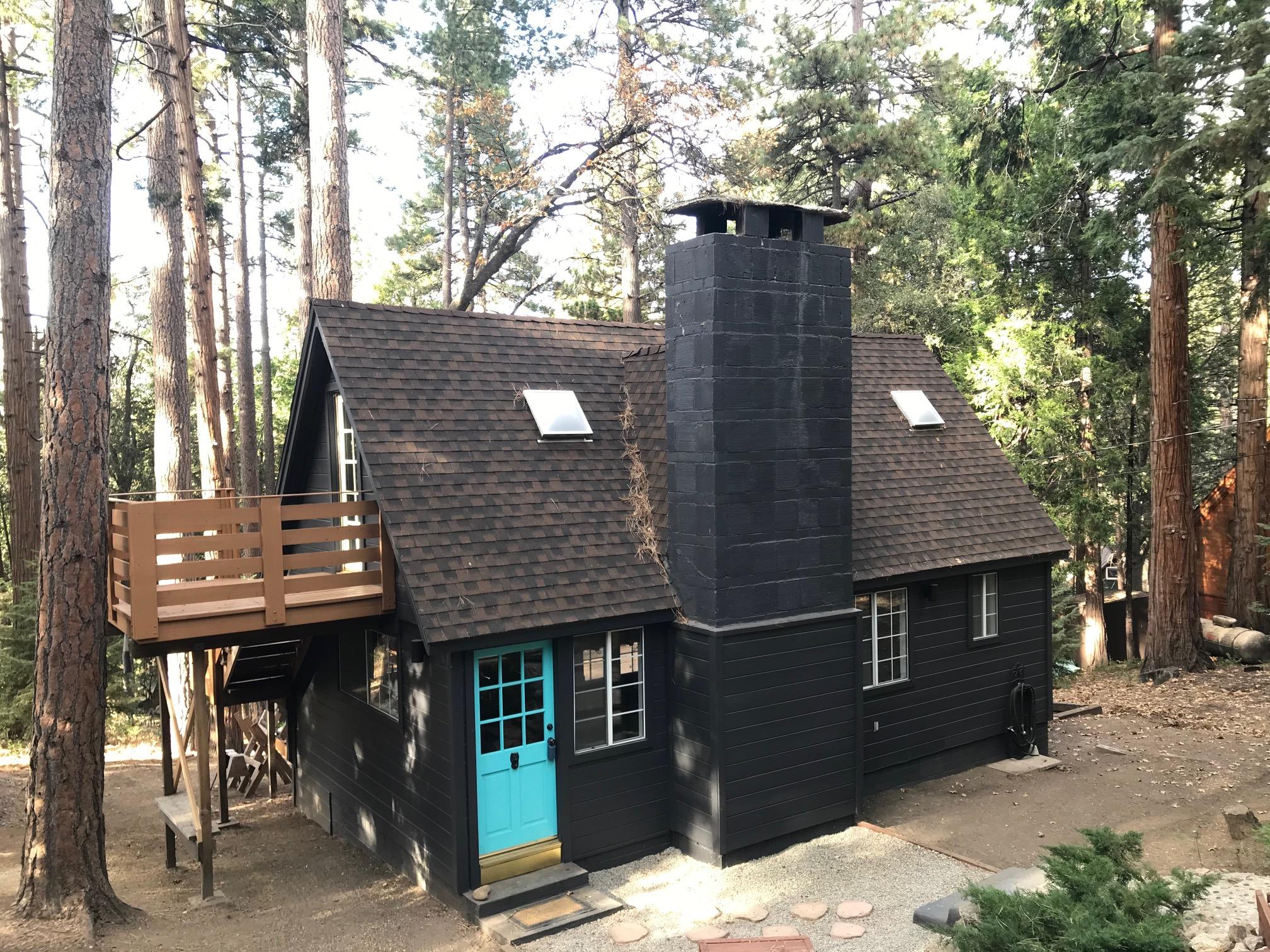 52760 Pine Ridge Road Idyllwild, CA 92549 - Photo 2 of 41 a view of a chairs and table in the backyard