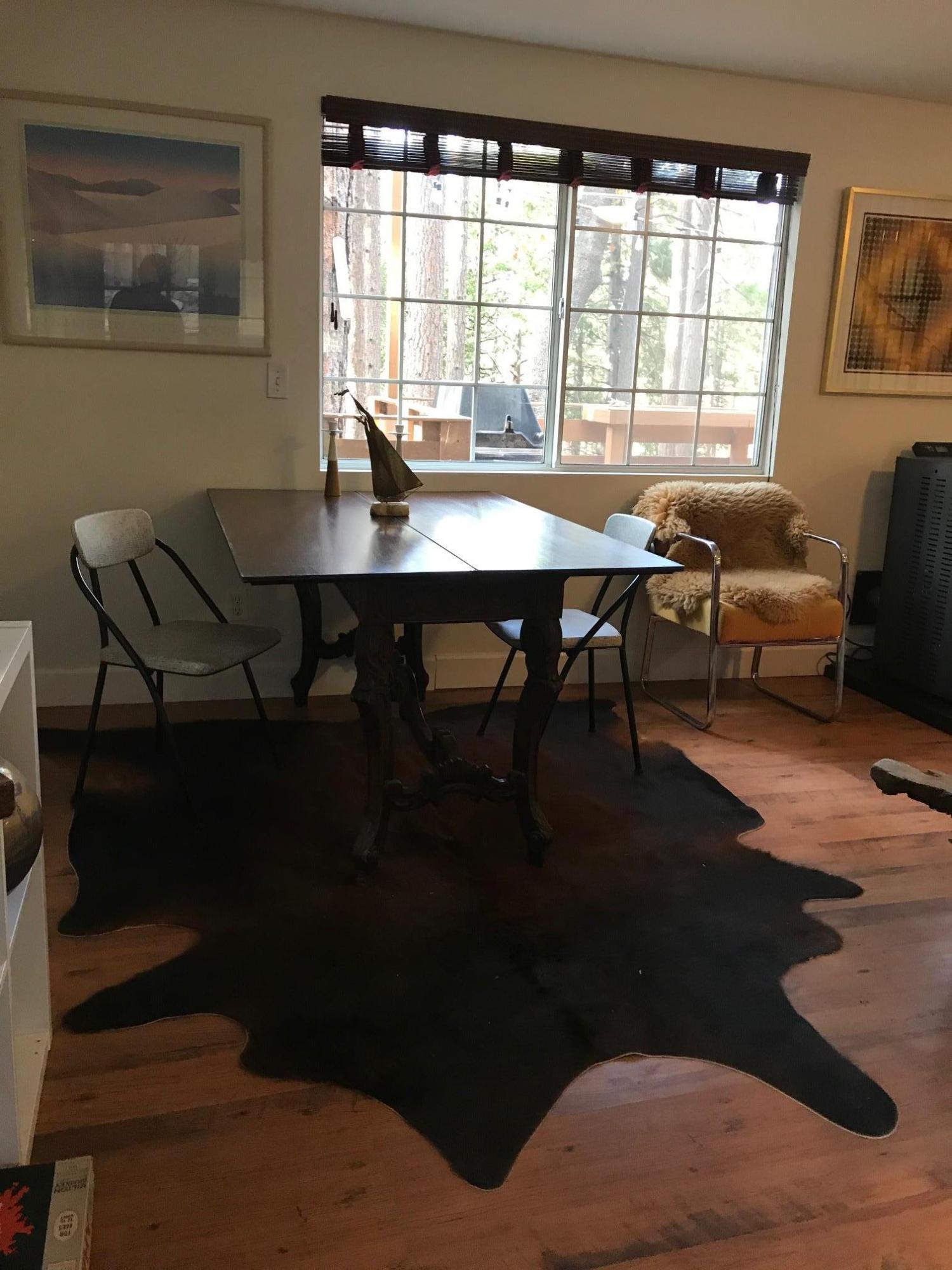 52760 Pine Ridge Road Idyllwild, CA 92549 - Photo 14 of 41 a view of a dining room with furniture and window
