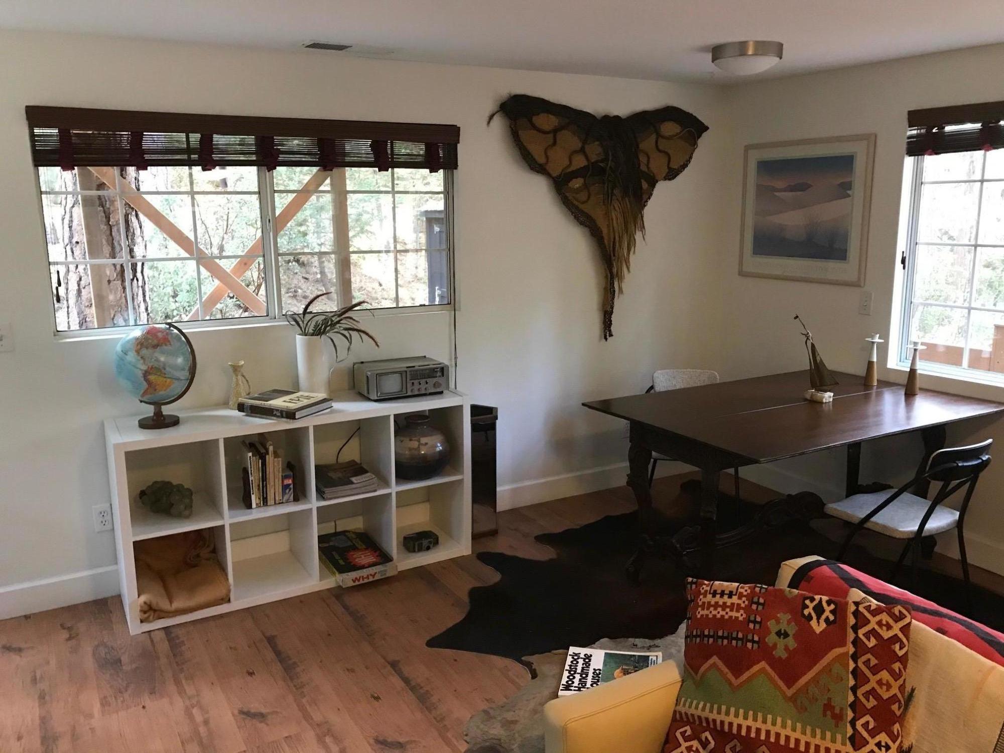 52760 Pine Ridge Road Idyllwild, CA 92549 - Photo 15 of 41 a living room with a couch and a table