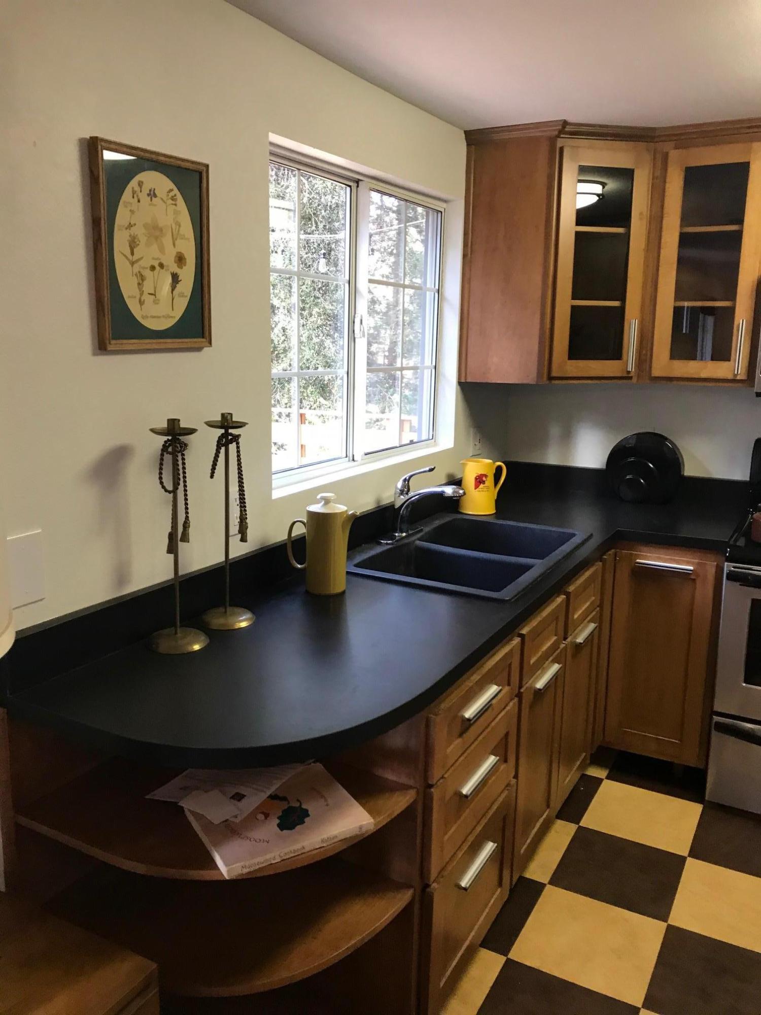 52760 Pine Ridge Road Idyllwild, CA 92549 - Photo 19 of 41 a kitchen with a sink a stove and cabinets