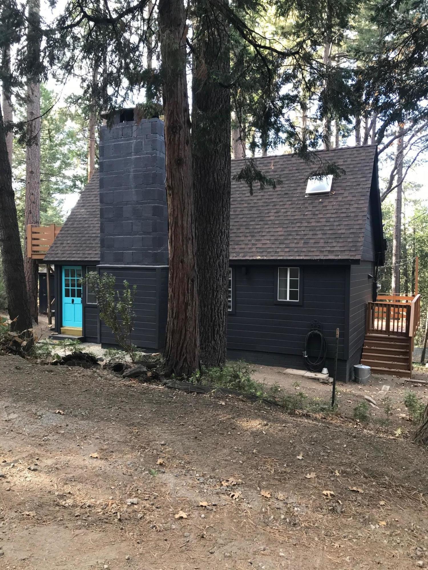 52760 Pine Ridge Road Idyllwild, CA 92549 - Photo 3 of 41 a front view of a house with parking area