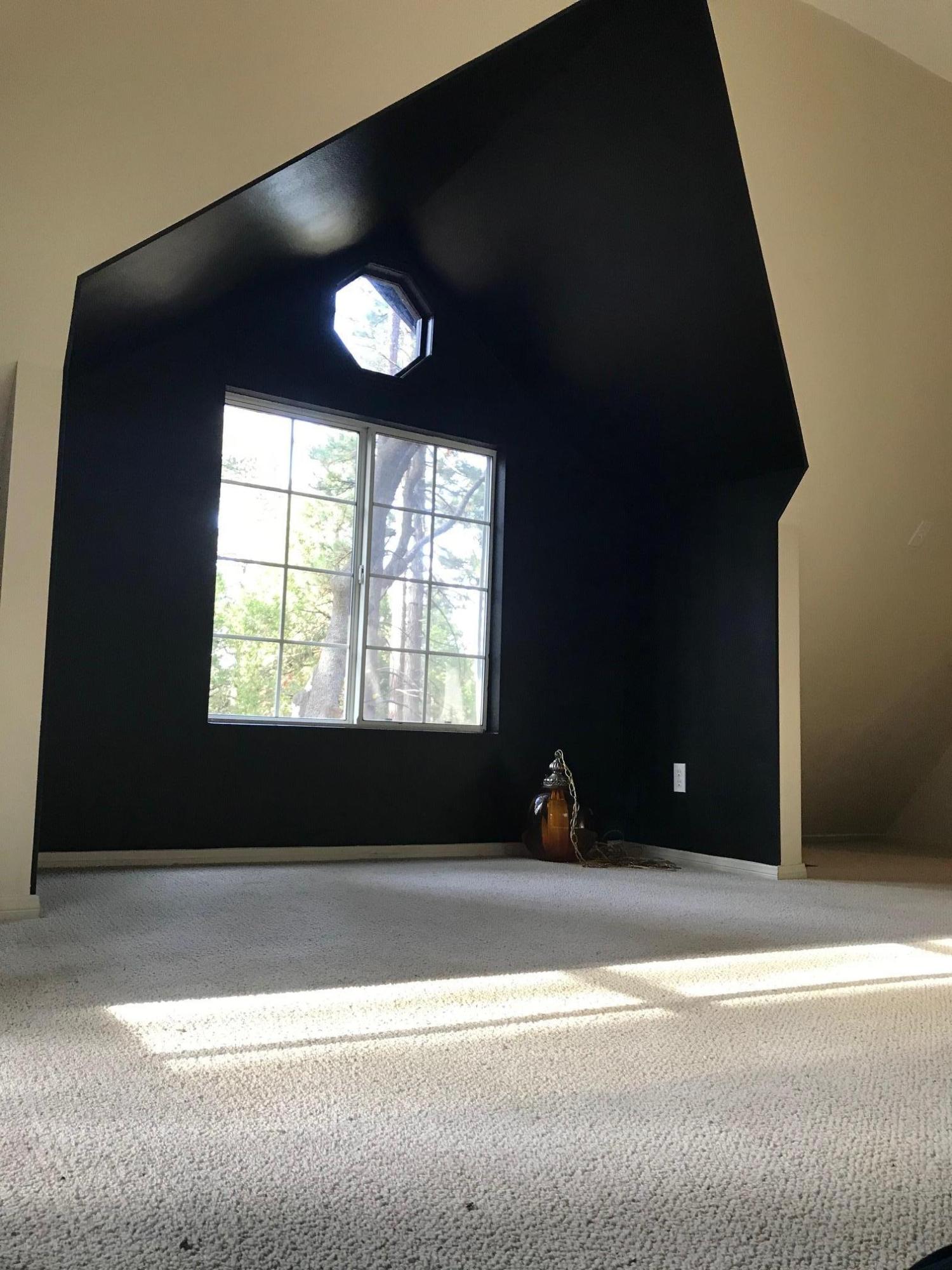 52760 Pine Ridge Road Idyllwild, CA 92549 - Photo 31 of 41 a view of a livingroom with a black and white floor to ceiling window