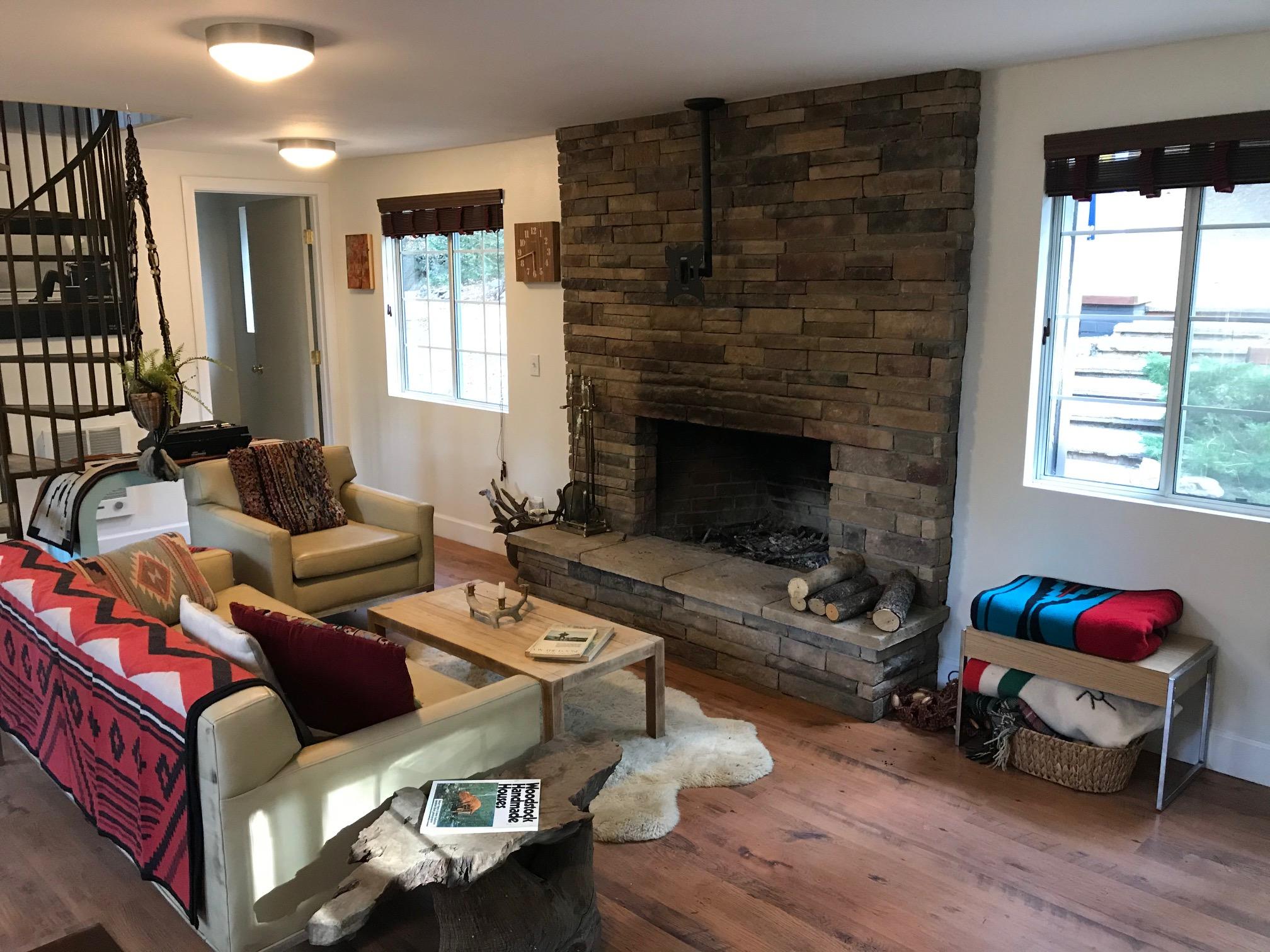 52760 Pine Ridge Road Idyllwild, CA 92549 - Photo 33 of 41 a living room with furniture and a fireplace