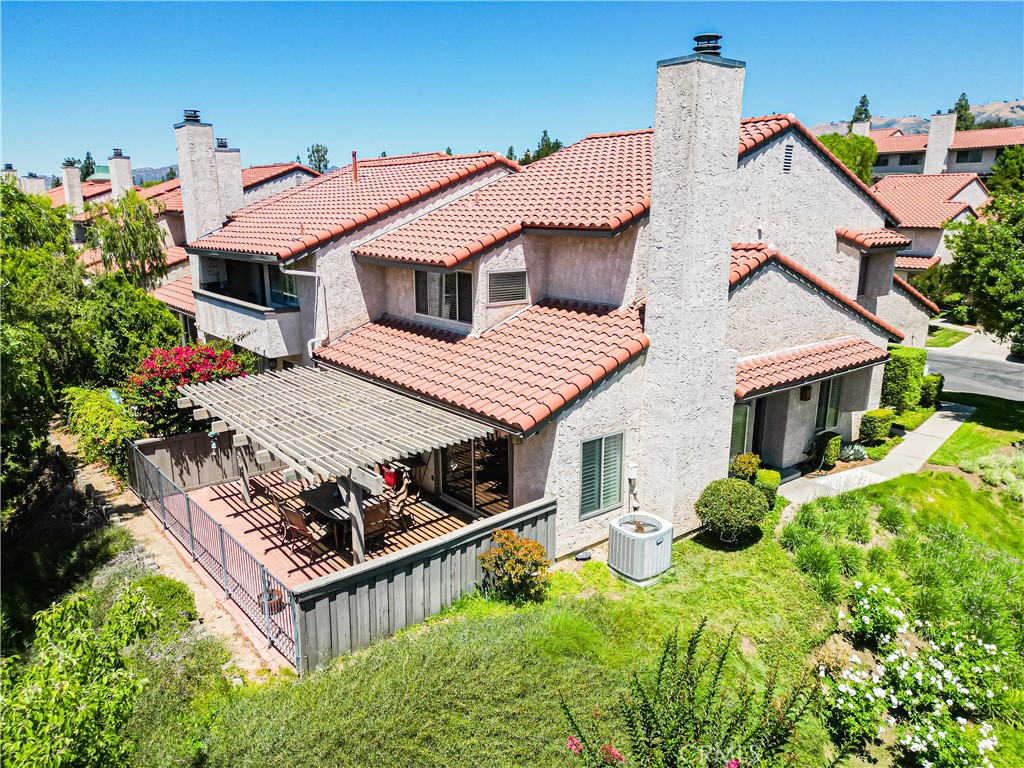 19229 Index Street, Unit 1 Porter Ranch, CA 91326 - Photo 1 of 1 a house with lots of trees in the background
