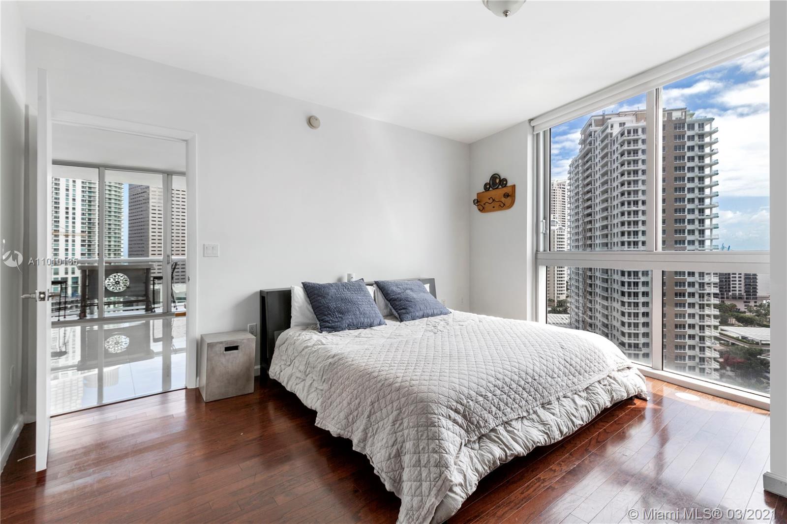 495 Brickell Avenue, Unit 1802 Miami, FL 33131 - Photo 11 of 29 a bedroom with double bed and a large window