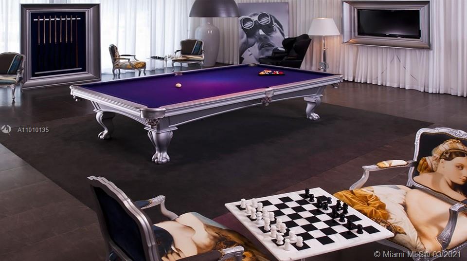 495 Brickell Avenue, Unit 1802 Miami, FL 33131 - Photo 24 of 29 a room with furniture and wooden floor