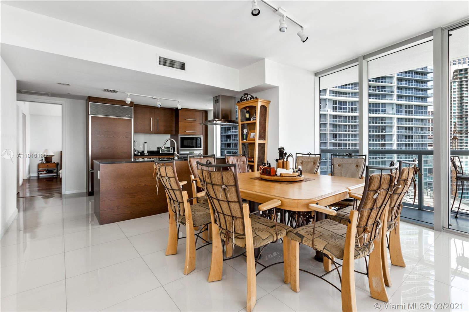 495 Brickell Avenue, Unit 1802 Miami, FL 33131 - Photo 5 of 29 a view of a dining room with furniture
