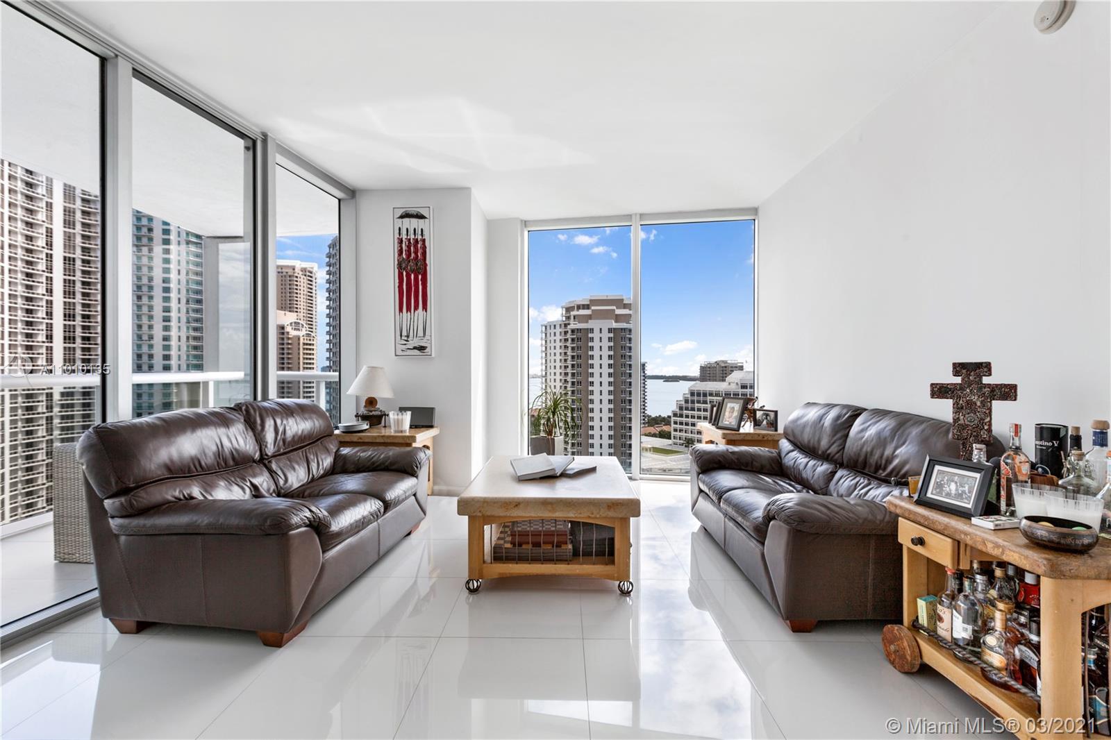 495 Brickell Avenue, Unit 1802 Miami, FL 33131 - Photo 6 of 29 a living room with furniture and a large window