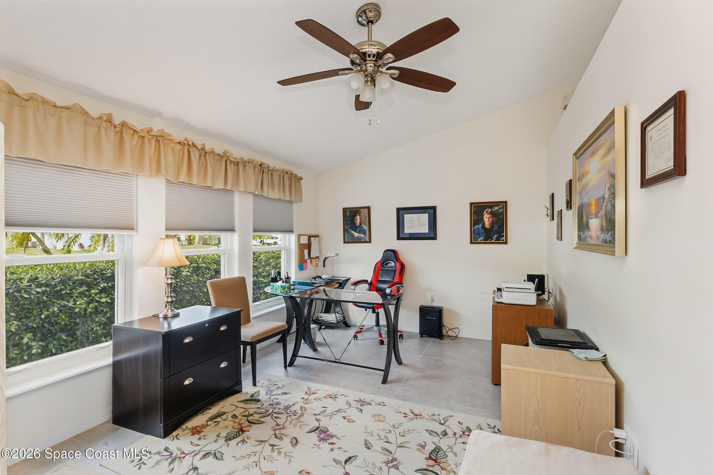 263 Mcclain Drive Melbourne, FL 32904 - Photo 20 of 56 a living room with furniture and a window