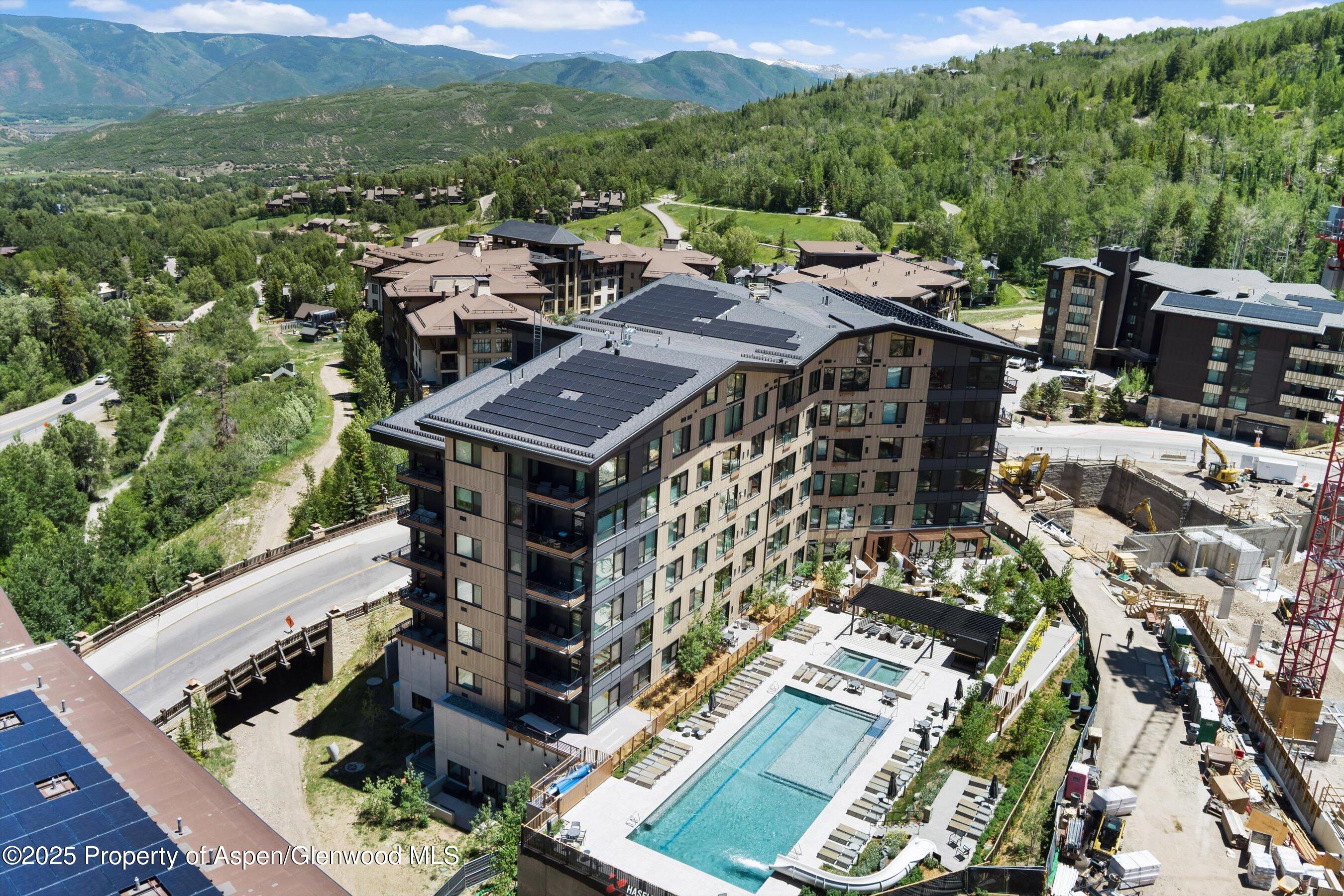 119 Wood Road, Unit 604 Snowmass Village, CO 81615 - Photo 27 of 48 a view of city from balcony with furniture