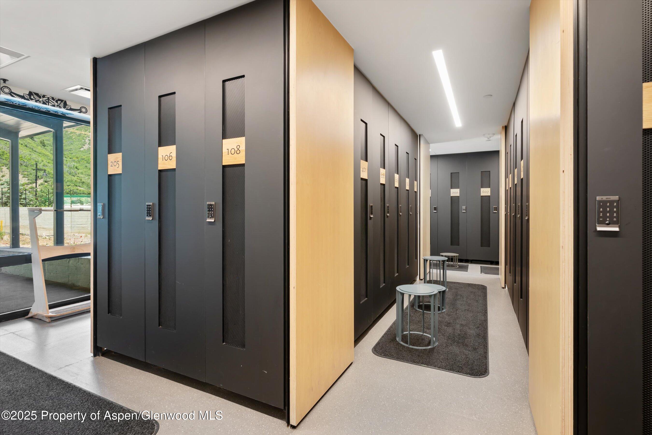 119 Wood Road, Unit 604 Snowmass Village, CO 81615 - Photo 30 of 48 a view of a hallway with a livingroom and furniture