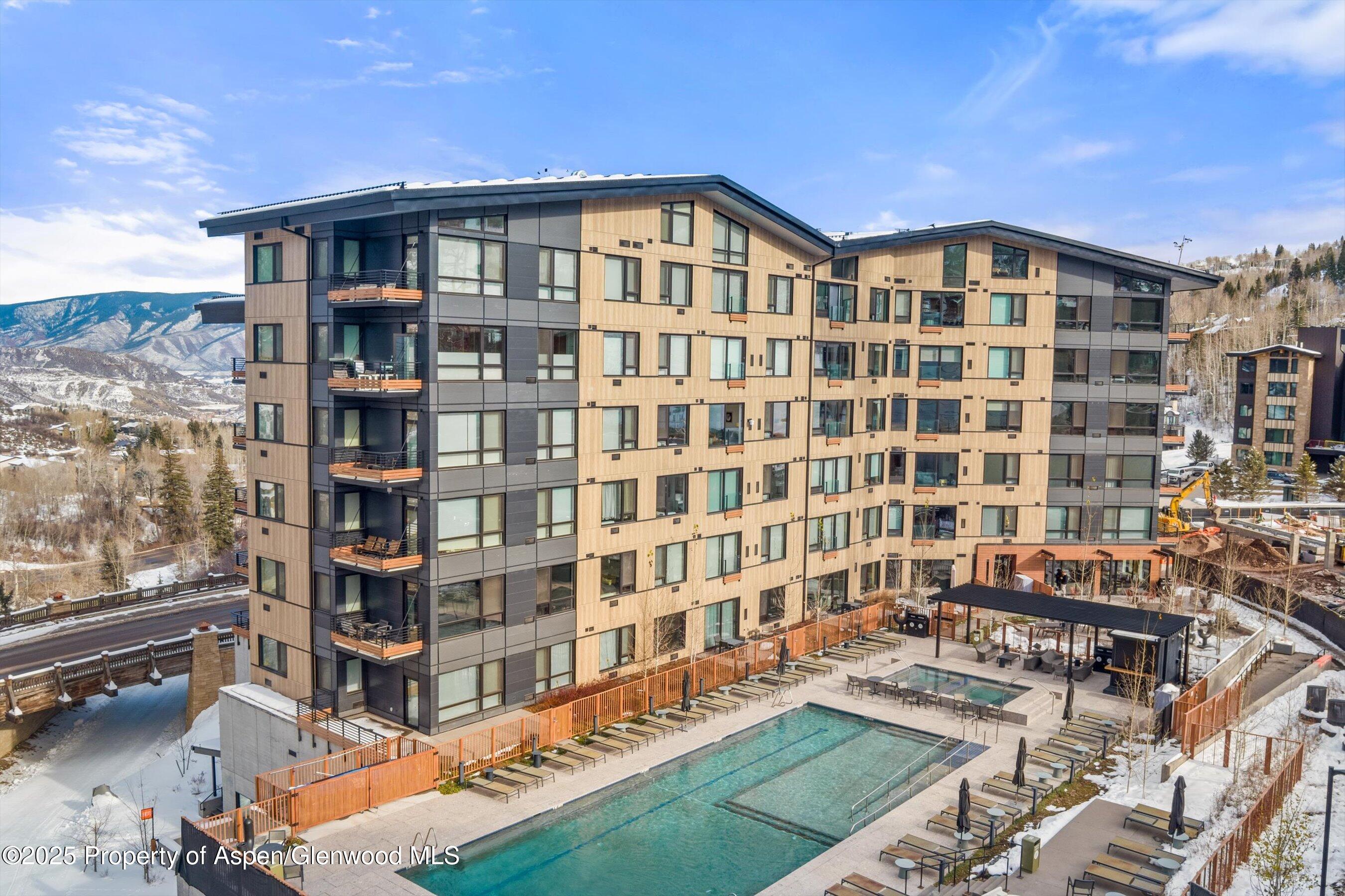 119 Wood Road, Unit 604 Snowmass Village, CO 81615 - Photo 36 of 48 a front view of a building with balcony