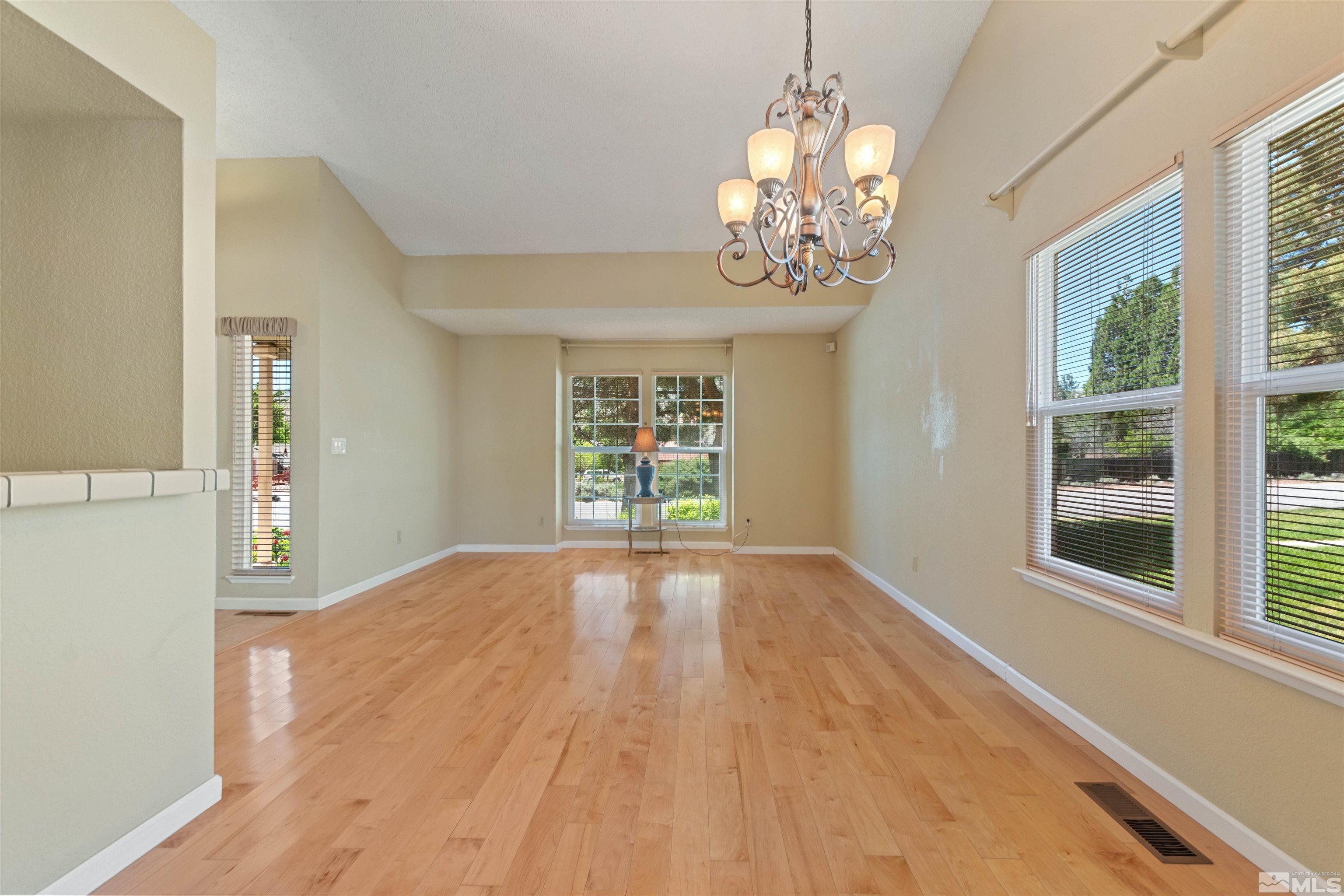 575 Cliff View Drive Reno, NV 89523 - Photo 13 of 33 a view of an empty room with wooden floor and a window