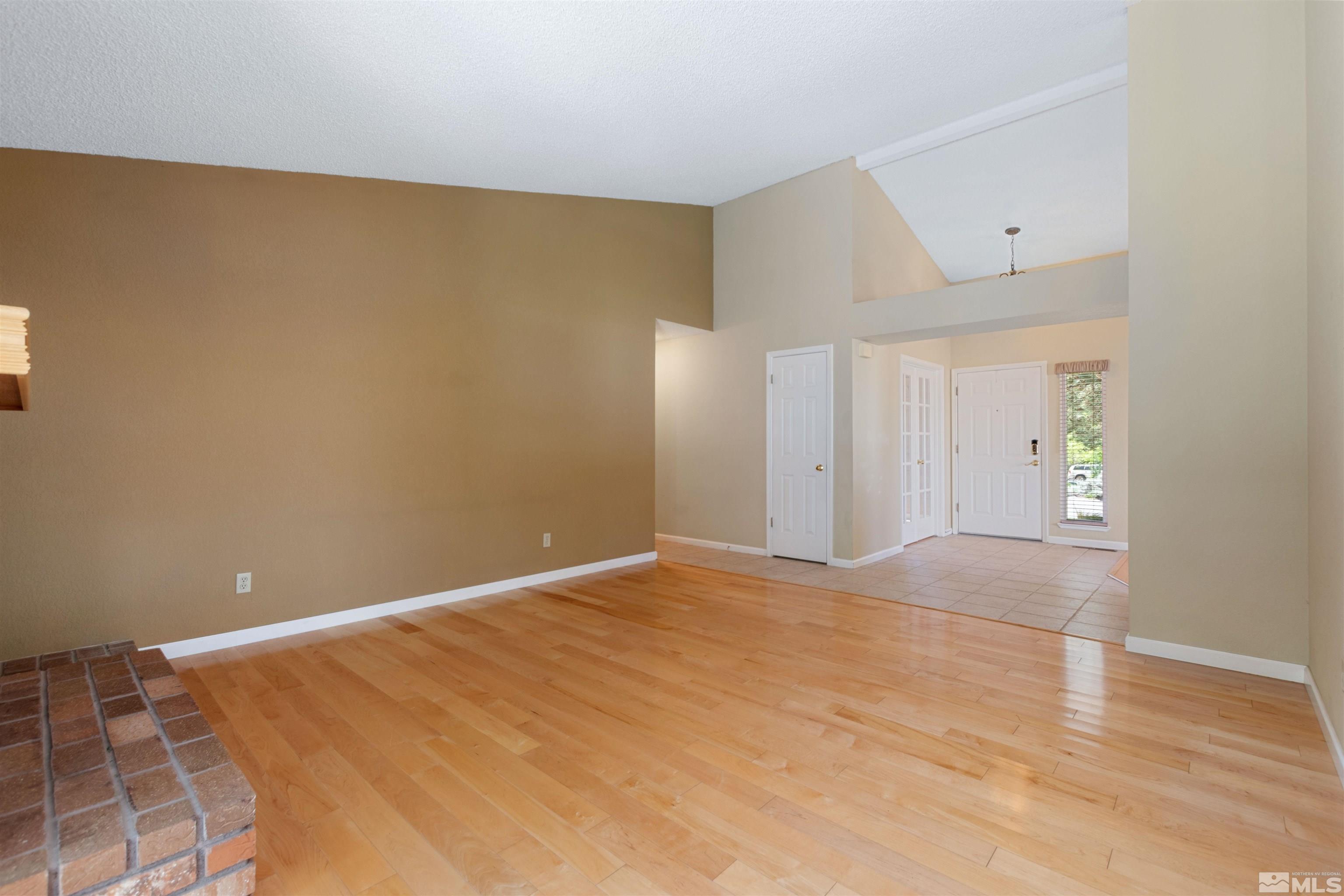 575 Cliff View Drive Reno, NV 89523 - Photo 16 of 33 a view of an empty room with wooden floor