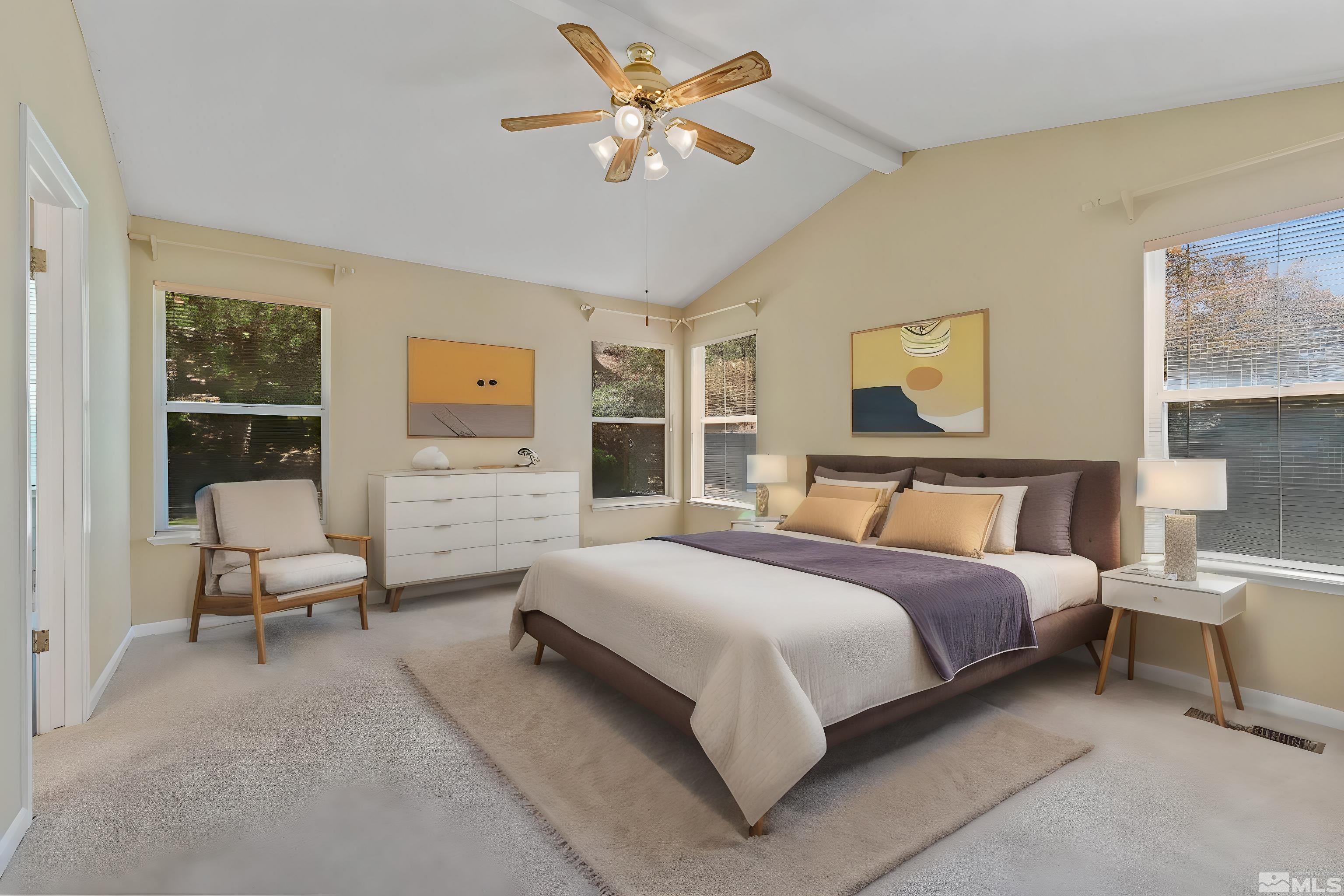 575 Cliff View Drive Reno, NV 89523 - Photo 20 of 33 a spacious bedroom with a bed and a chandelier