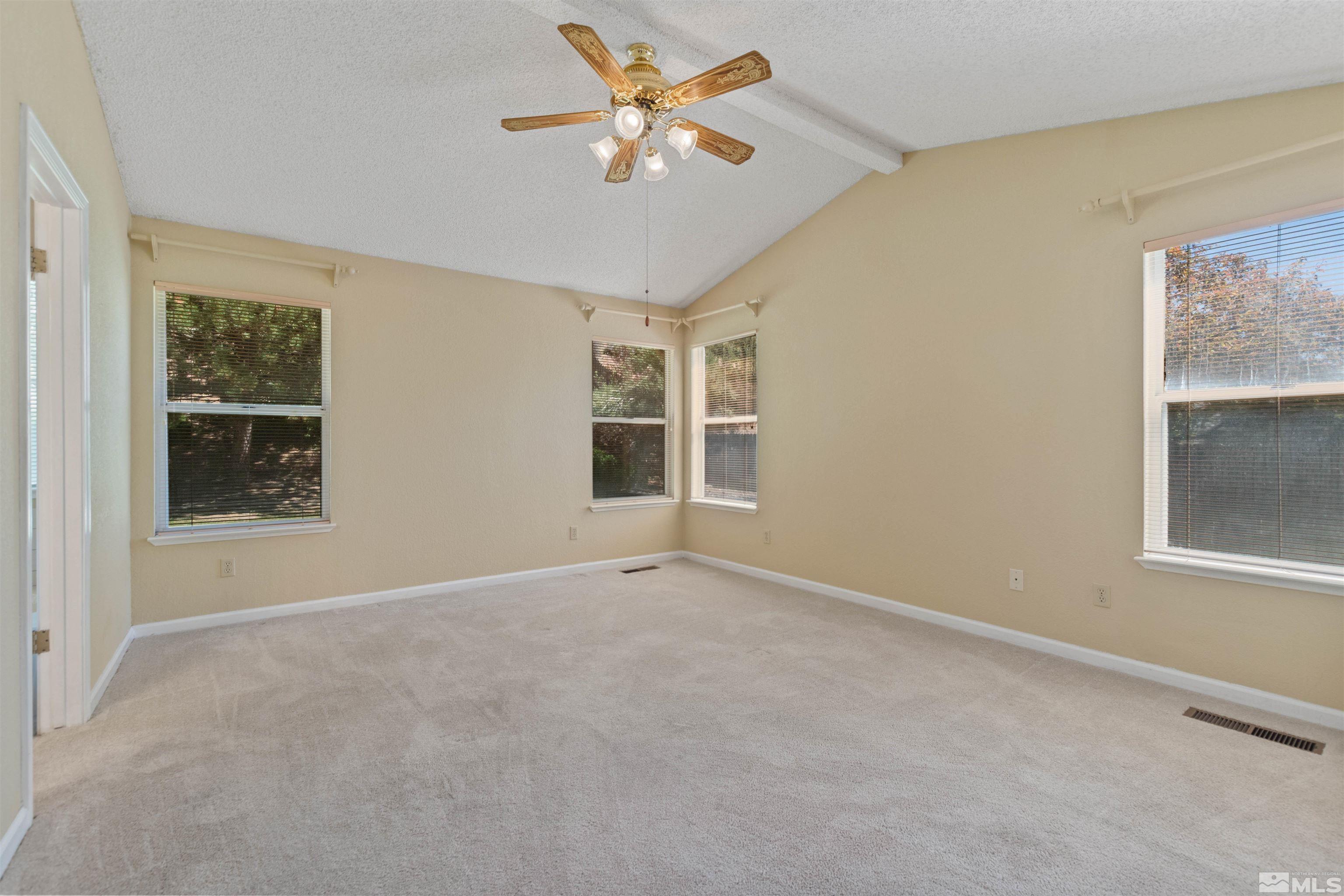 575 Cliff View Drive Reno, NV 89523 - Photo 21 of 33 an empty room with windows and fan