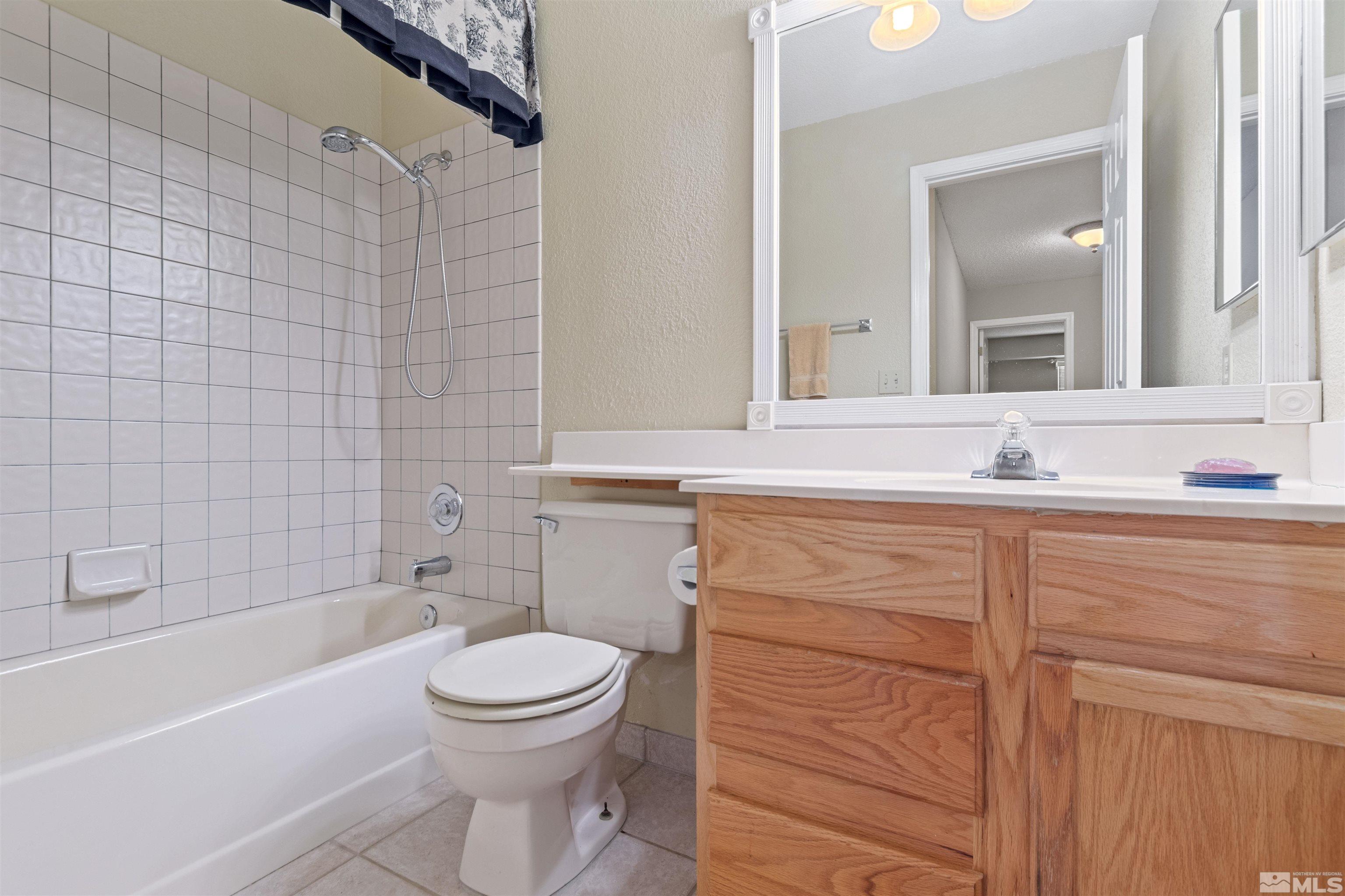 575 Cliff View Drive Reno, NV 89523 - Photo 27 of 33 a bathroom with a sink toilet and shower