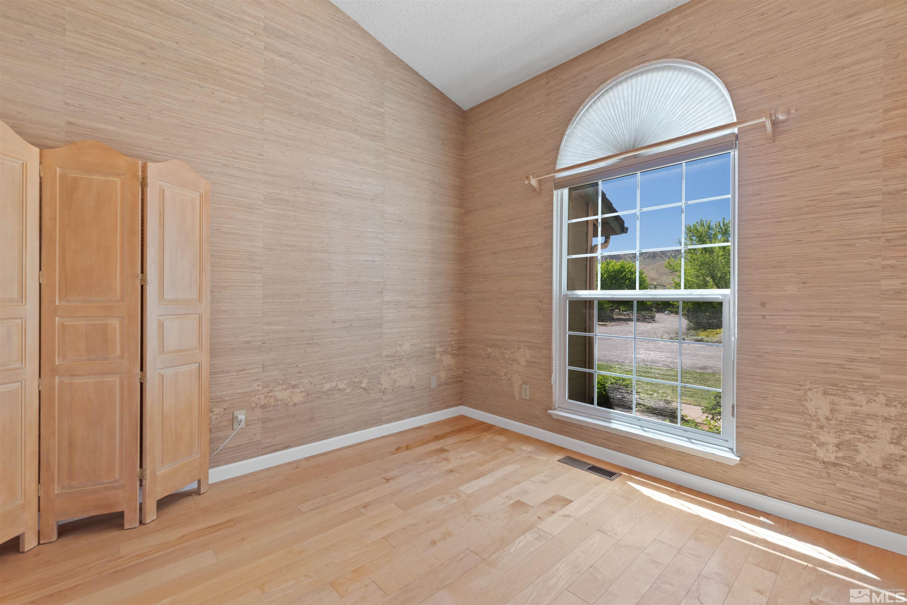 575 Cliff View Drive Reno, NV 89523 - Photo 28 of 33 a view of empty room with wooden floor and fan