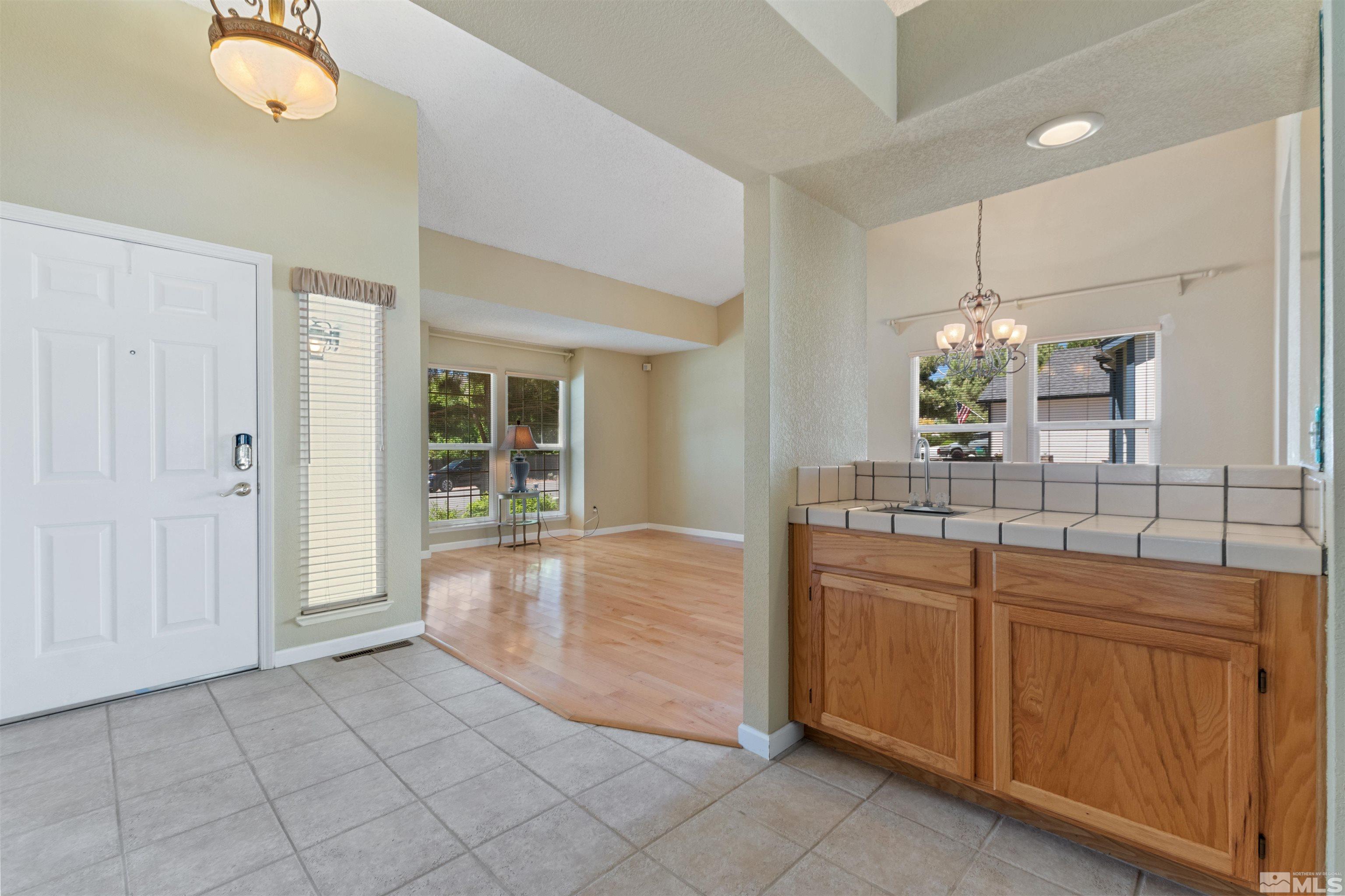 575 Cliff View Drive Reno, NV 89523 - Photo 33 of 33 a bathroom with a granite countertop sink and a mirror