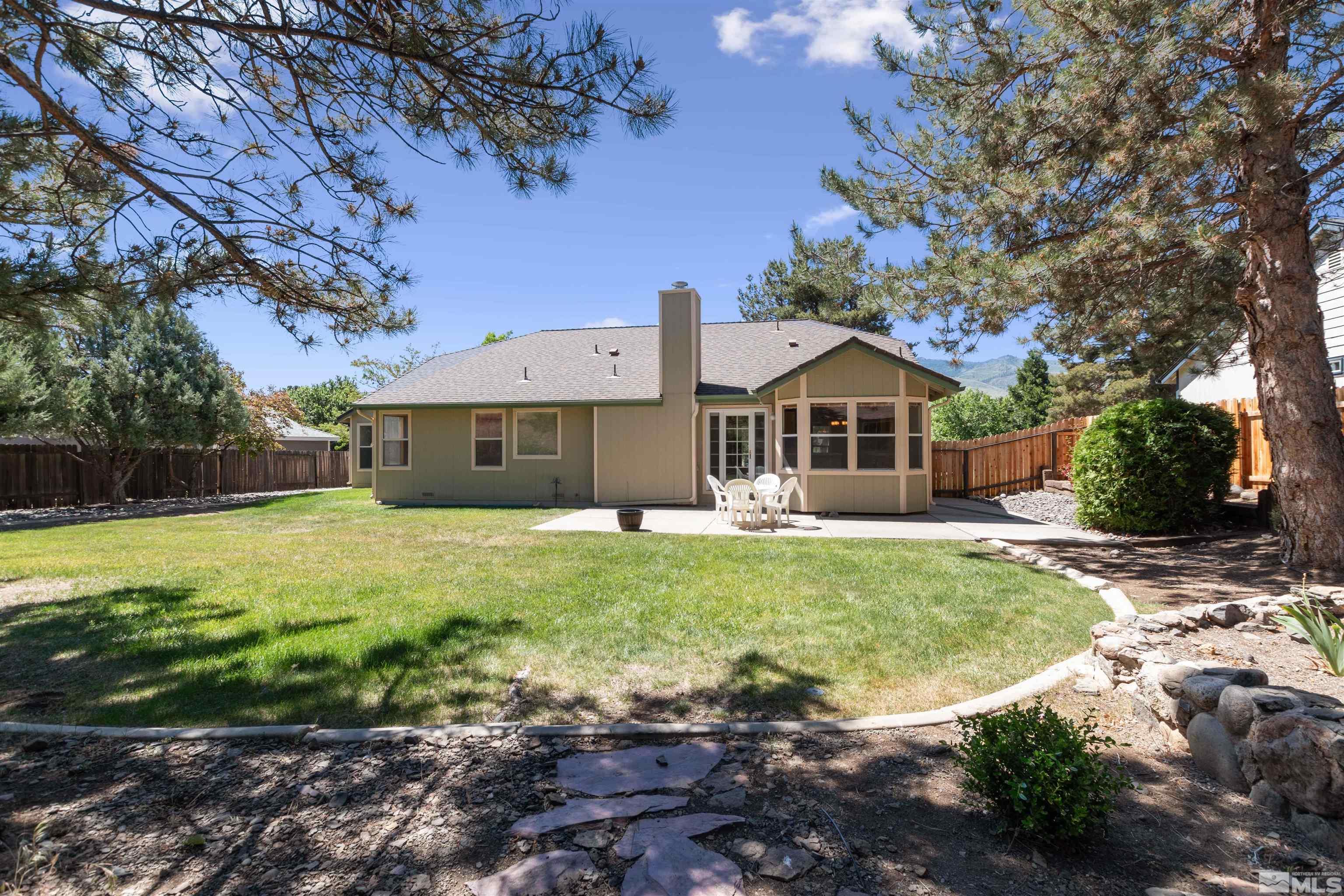 575 Cliff View Drive Reno, NV 89523 - Photo 4 of 33 a front view of a house with a garden