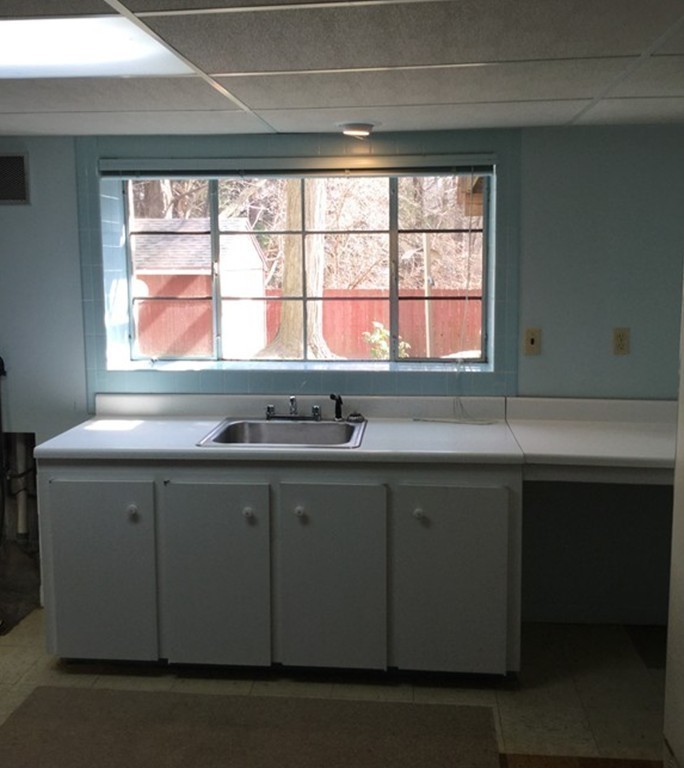 150 Barton Road Wellesley, MA 02481 - Photo 14 of 20 a kitchen with a sink and a window