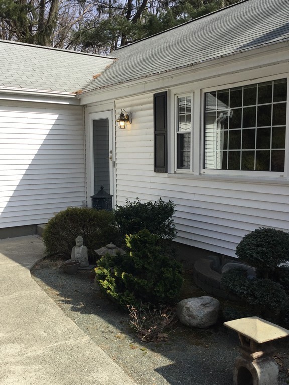 150 Barton Road Wellesley, MA 02481 - Photo 2 of 20 a front view of a house with sitting area