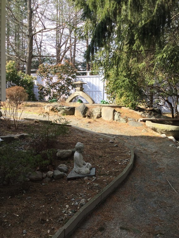 150 Barton Road Wellesley, MA 02481 - Photo 7 of 20 a view of a yard with wooden fence