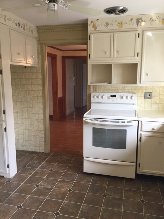 150 Barton Road Wellesley, MA 02481 - Photo 8 of 20 a white stove top oven sitting inside of a kitchen