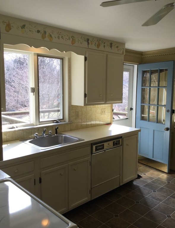 150 Barton Road Wellesley, MA 02481 - Photo 9 of 20 a kitchen with a sink and a large window