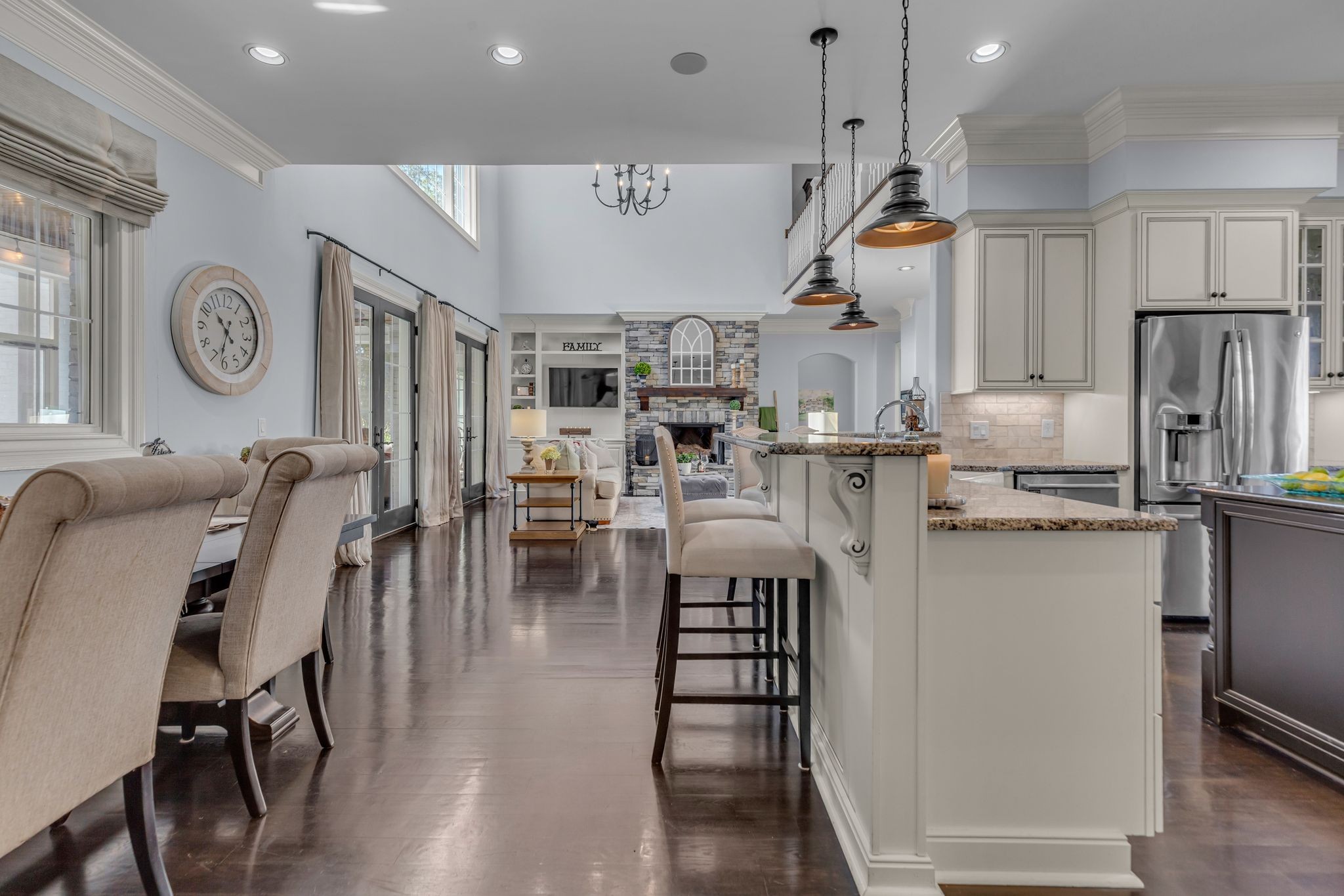 7167 Williams Road Christiana, TN 37037 - Photo 13 of 53 a kitchen with stainless steel appliances granite countertop a refrigerator a stove and a dining table with wooden floor