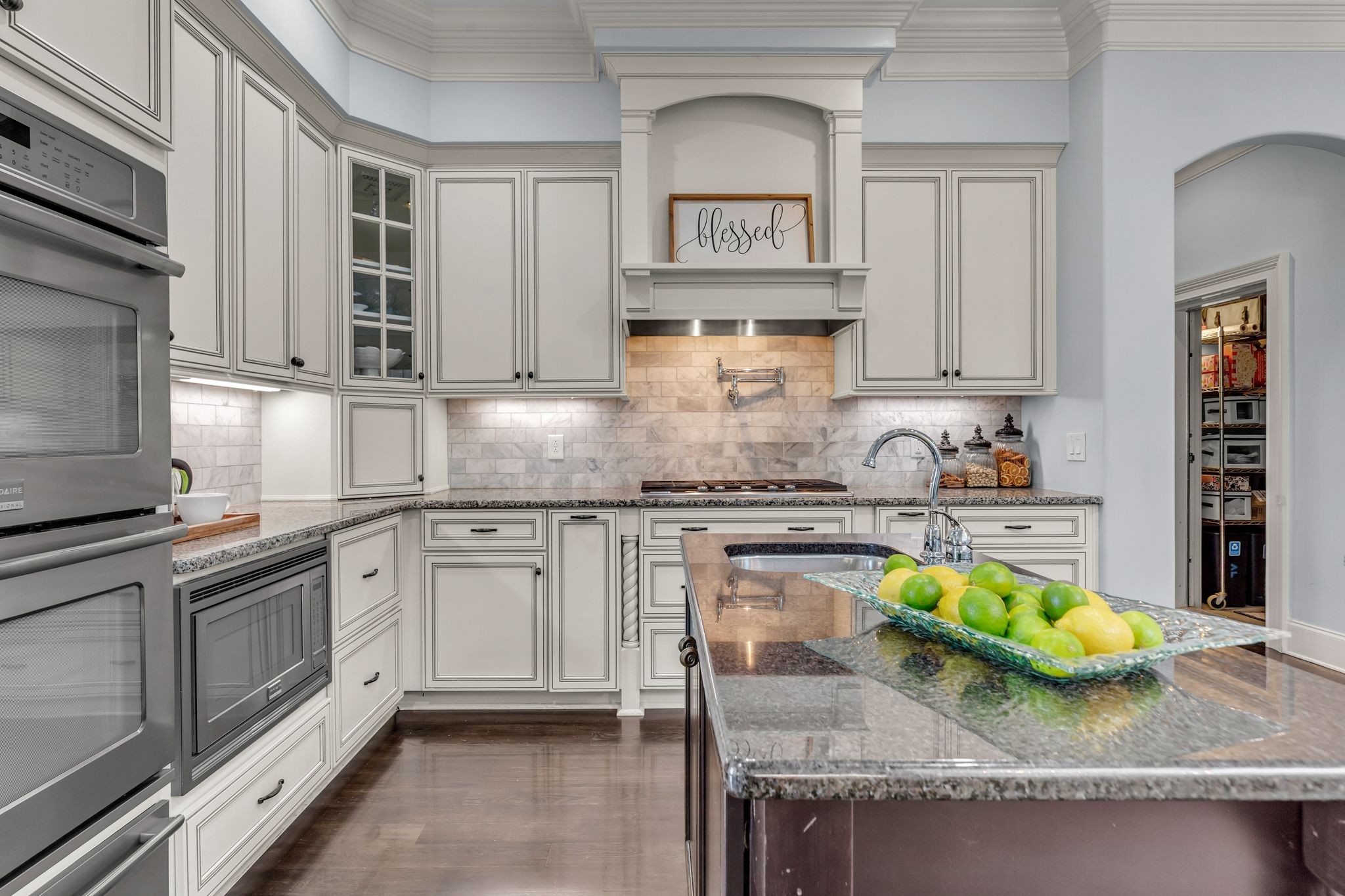 7167 Williams Road Christiana, TN 37037 - Photo 17 of 53 a kitchen with granite countertop a sink a stove and cabinets