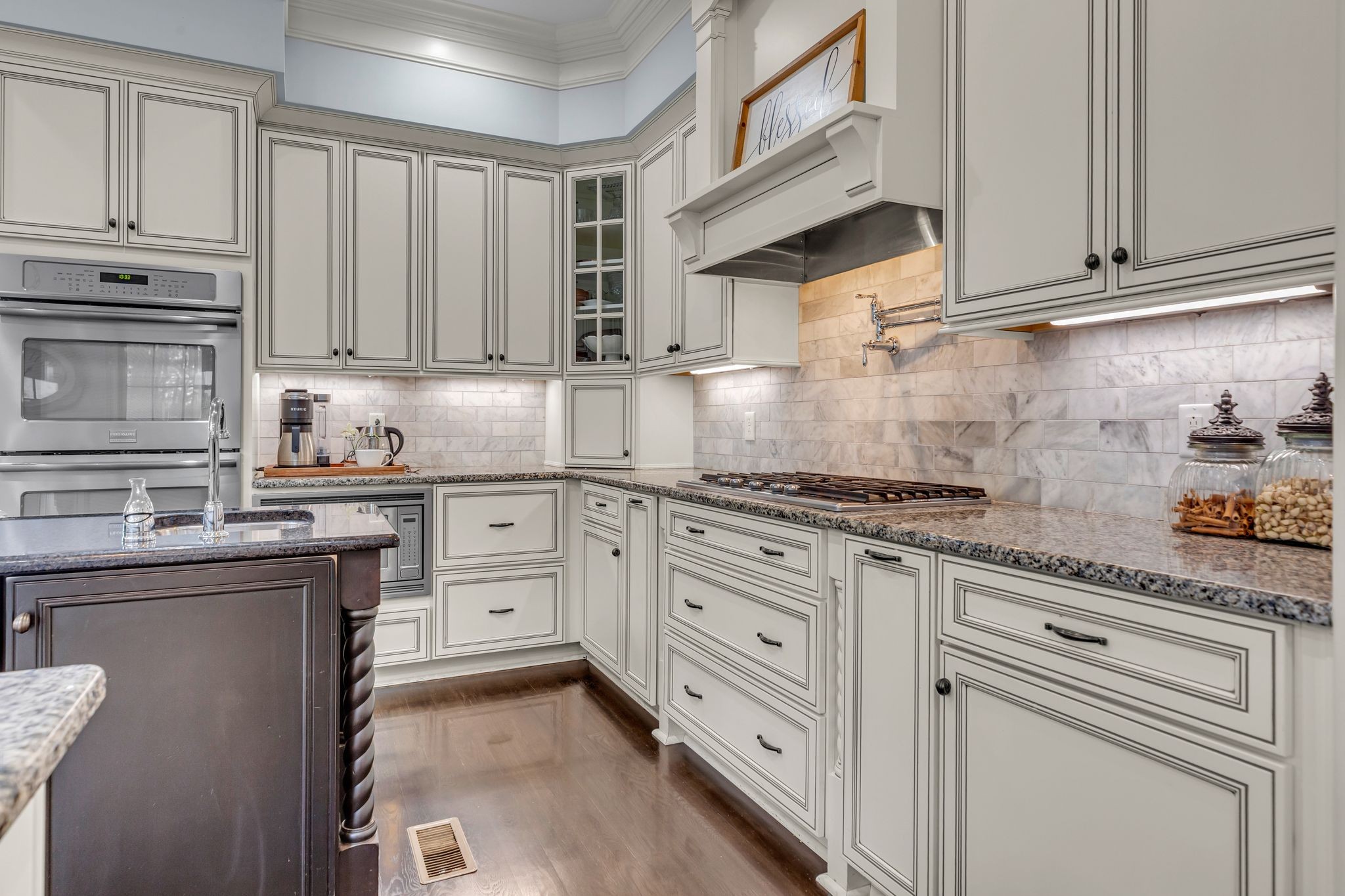 7167 Williams Road Christiana, TN 37037 - Photo 18 of 53 a kitchen with granite countertop cabinets stainless steel appliances and a sink
