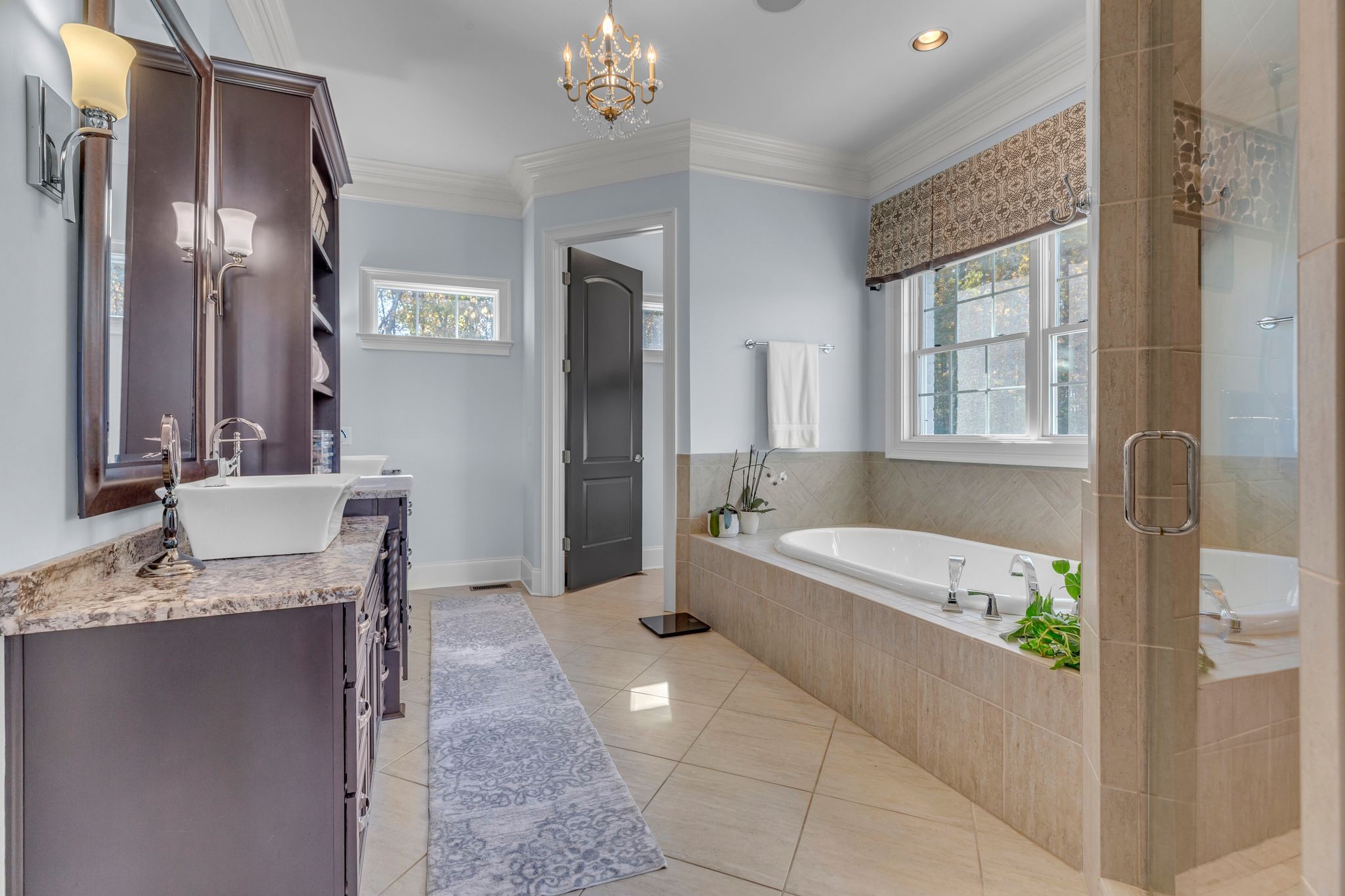 7167 Williams Road Christiana, TN 37037 - Photo 29 of 53 a spacious bathroom with a granite countertop tub shower and mirror