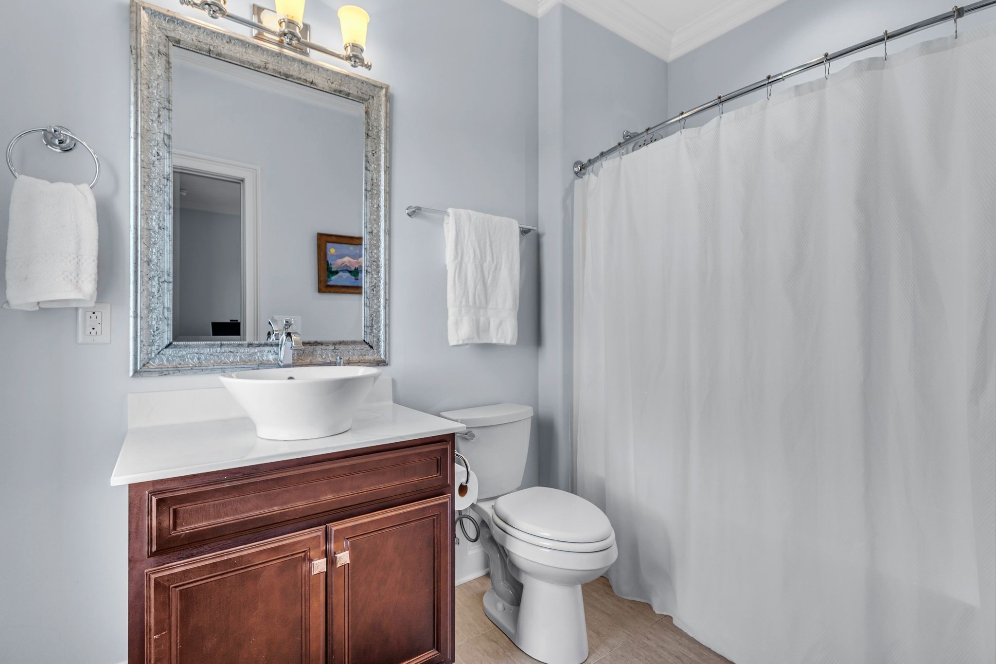 7167 Williams Road Christiana, TN 37037 - Photo 41 of 53 a bathroom with a sink a toilet a mirror and shower curtain