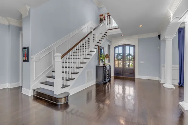 a view of a livingroom with furniture window and wooden floor