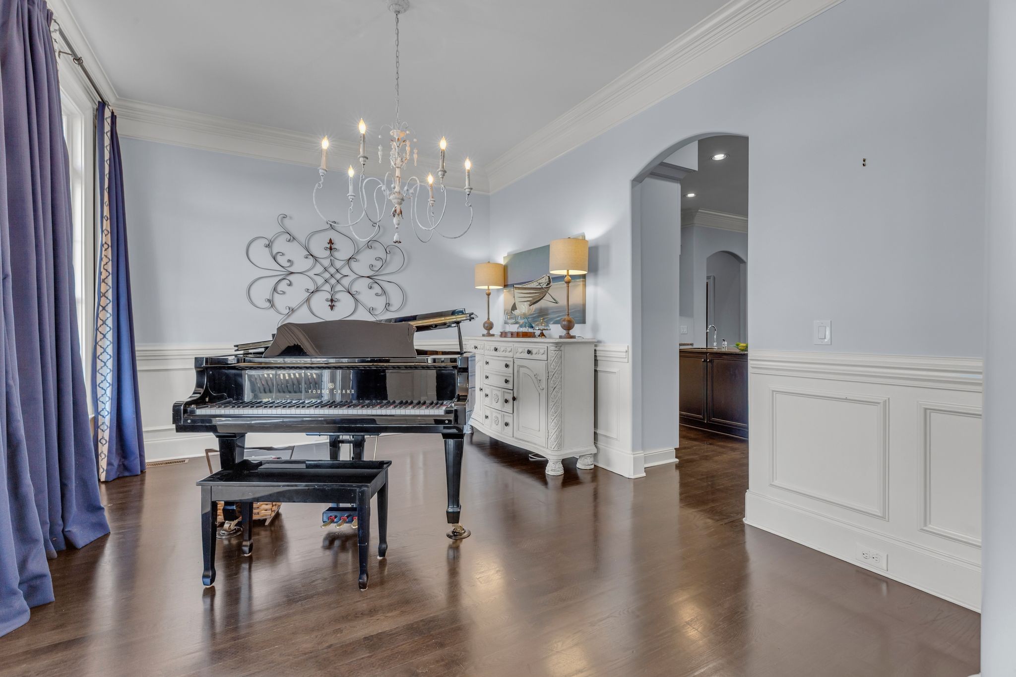 7167 Williams Road Christiana, TN 37037 - Photo 7 of 53 a view of a dining room with furniture wooden floor and a chandelier