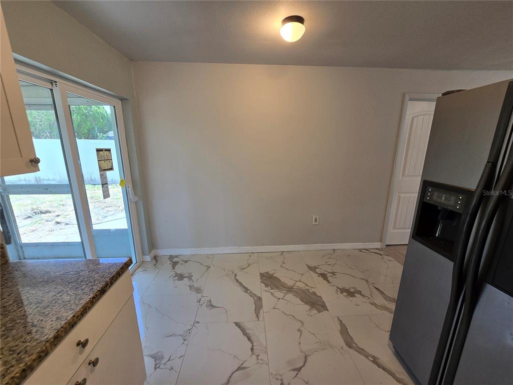 3406 Murrow Street New Port Richey, FL 34655 - Photo 13 of 21 a view of an empty room and window