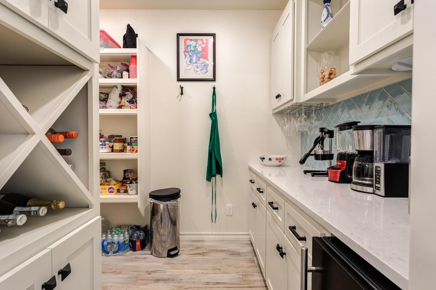 4908 109th Place Lubbock, TX 79424 - Photo 12 of 44 a kitchen with stainless steel appliances a cabinets and a wooden floor