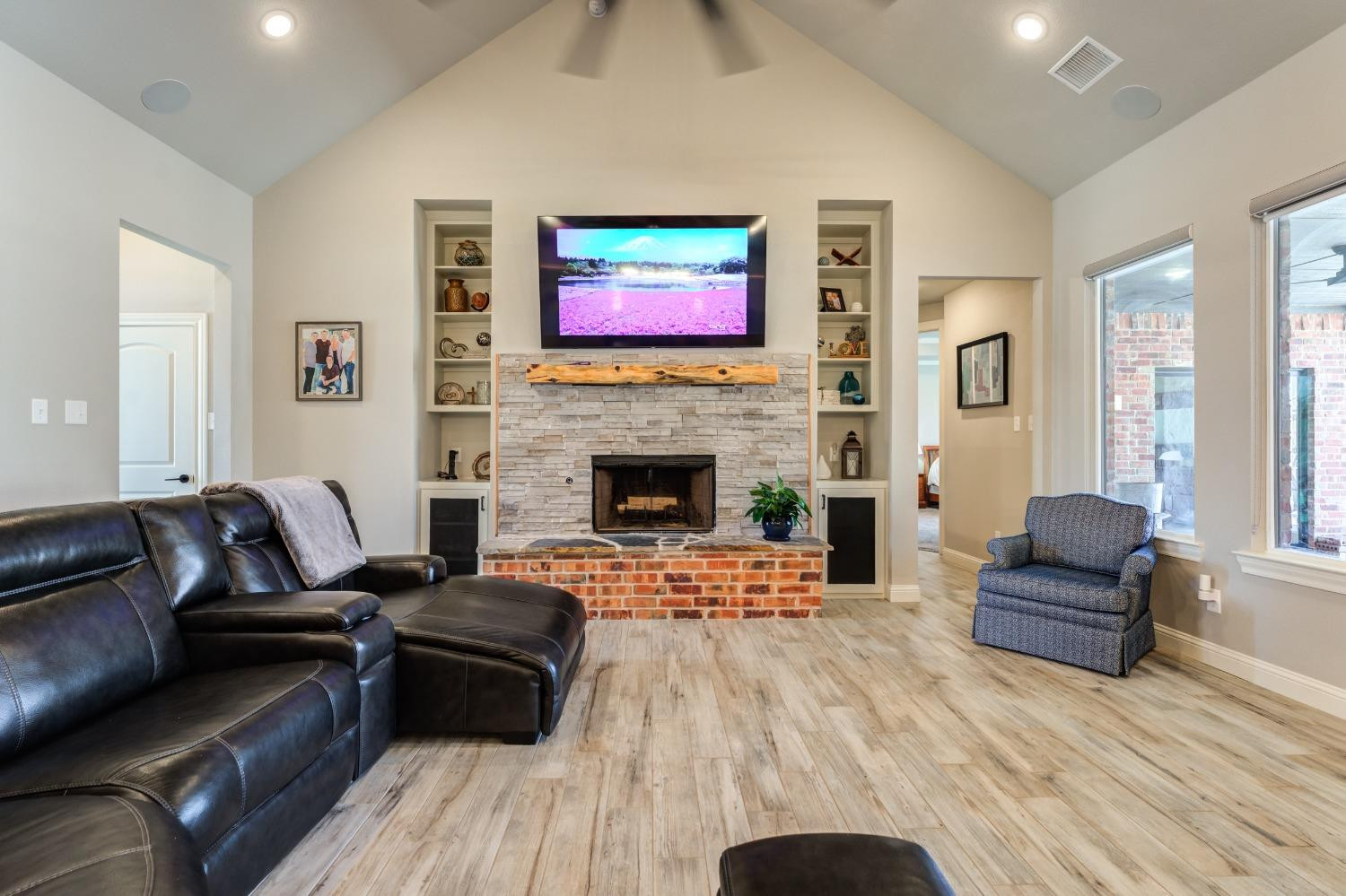 4908 109th Place Lubbock, TX 79424 - Photo 19 of 44 a living room with furniture and a fireplace