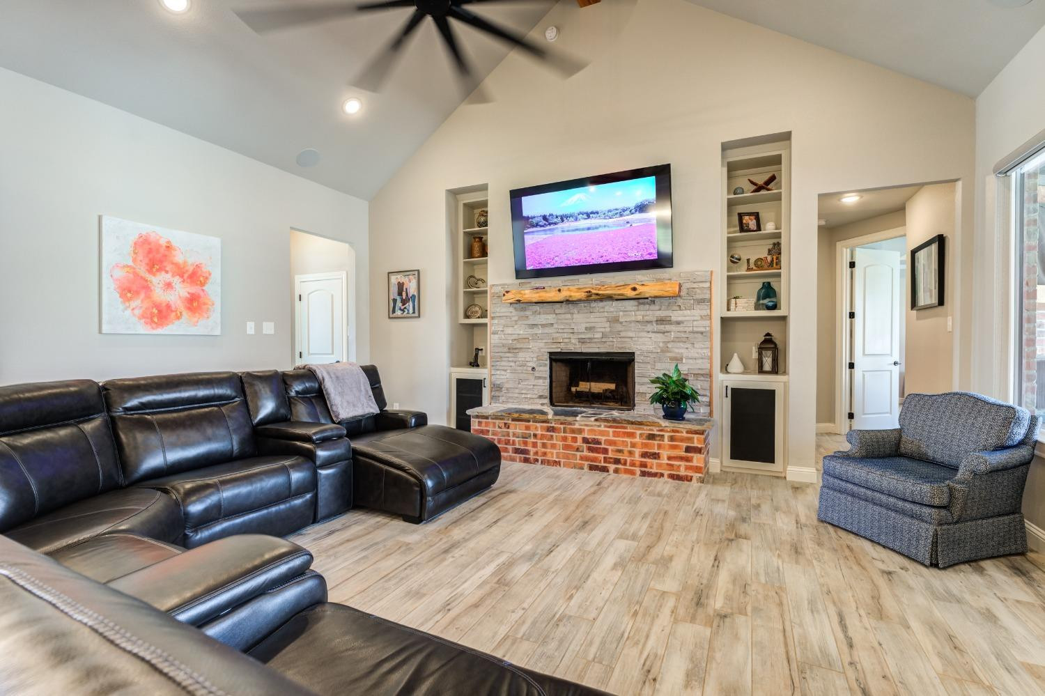 4908 109th Place Lubbock, TX 79424 - Photo 20 of 44 a living room with furniture and a fireplace