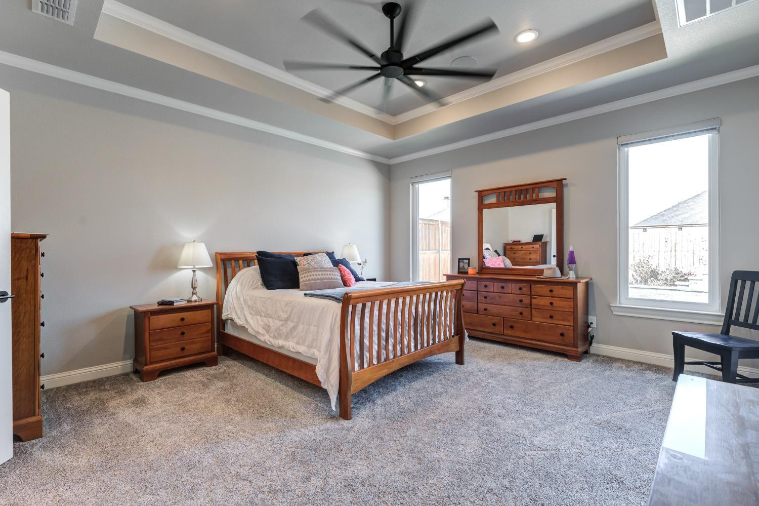 4908 109th Place Lubbock, TX 79424 - Photo 21 of 44 a bedroom with a bed and a window
