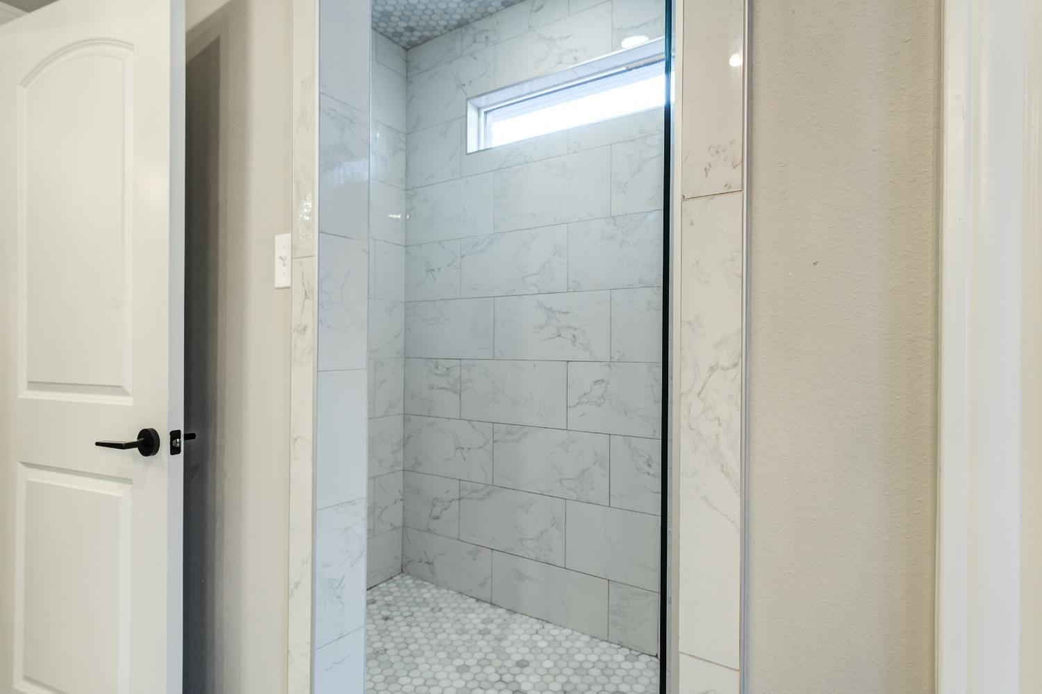 4908 109th Place Lubbock, TX 79424 - Photo 23 of 44 a bathroom with a shower