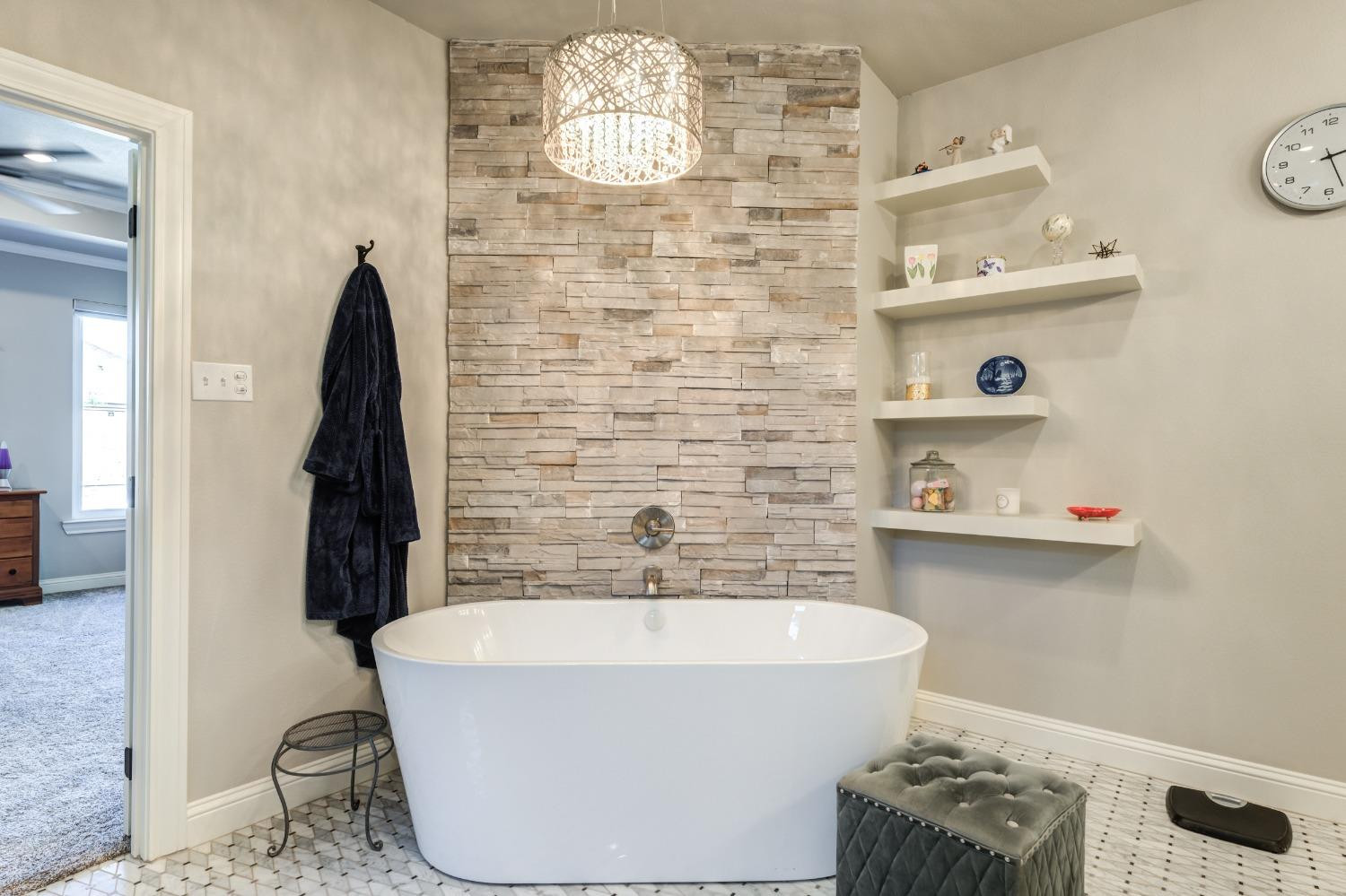 4908 109th Place Lubbock, TX 79424 - Photo 24 of 44 a bathroom with a bathtub and shower