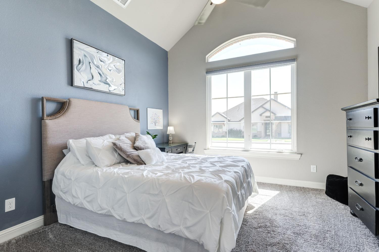 4908 109th Place Lubbock, TX 79424 - Photo 29 of 44 a bedroom with a bed and a window