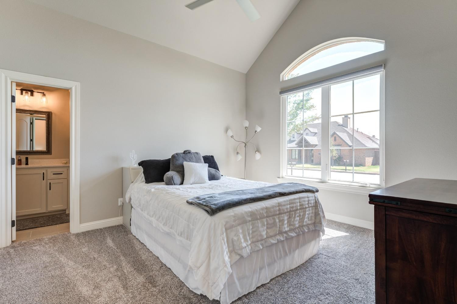 4908 109th Place Lubbock, TX 79424 - Photo 31 of 44 a bedroom with a bed and a window