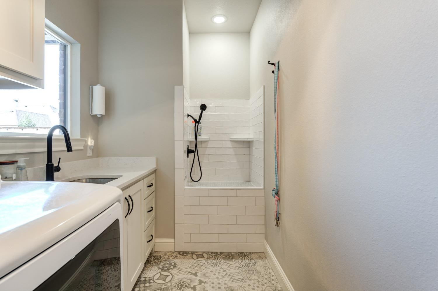 4908 109th Place Lubbock, TX 79424 - Photo 35 of 44 a bathroom with a sink and shower
