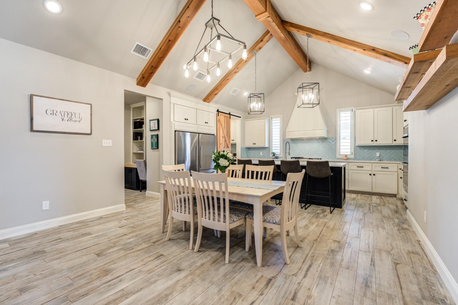 4908 109th Place Lubbock, TX 79424 - Photo 5 of 44 a dining room with furniture and wooden floor