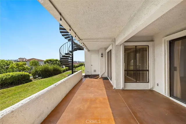 a view of a balcony with an outdoor space