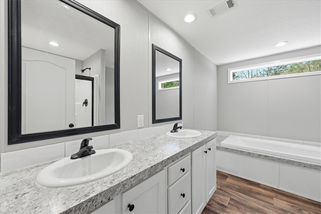 205 Union Court West Union, SC 29696 - Photo 17 of 28 Main bath has dual vanities and a relaxing soaking tub for ultimate comfort.